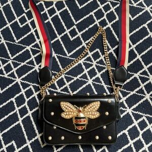 Elegant Black Designer Bag with Gold Accents